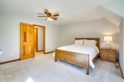 a bedroom with a bed and a ceiling fan at Spacious Thornville Home about 8 Mi to Buckeye Lake! in Thornville