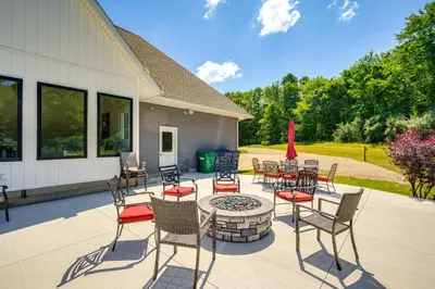 a patio with chairs and a table and a fire pit at Spacious Thornville Home about 8 Mi to Buckeye Lake! in Thornville