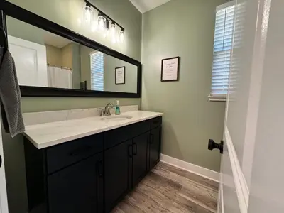 a bathroom with a sink and a mirror at 100 Acre Relaxing Retreat Near ARK- The Cabin in Williamstown