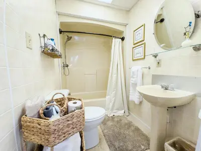 a bathroom with a toilet and a sink at Victorian Inn Bed And Breakfast in Marblehead