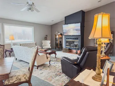 a living room with a couch and a table at Victorian Inn Bed And Breakfast in Marblehead