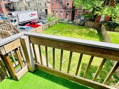 a view of a yard from a balcony at Jungle House Luxury Homes - Columbus Downtown Short North - Walk to Convention Center & Nationwide Arena - Sleeps up to 8 - Free Parking - Over 5,800 Five Stars in Columbus