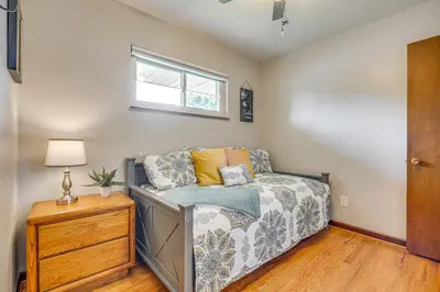 a living room with a couch and a window at 7 Mi to Downtown Columbus Family Getaway with Yard in Columbus