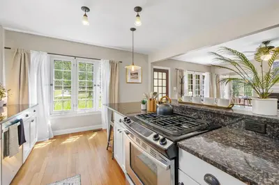 a kitchen with a stove and a counter top at The Knocking Bird- Mins to CLE Clinic in Cleveland Heights
