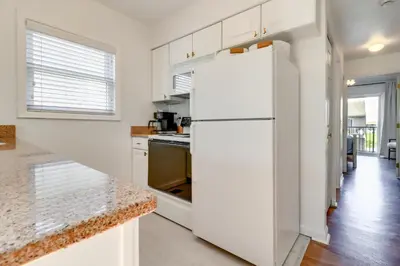 a white refrigerator in a kitchen with a counter at 13 Mi to Port Clinton Lake Erie Getaway with Dock in Oak Harbor
