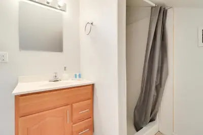 a bathroom with a sink and a mirror at 13 Mi to Port Clinton Lake Erie Getaway with Dock in Oak Harbor