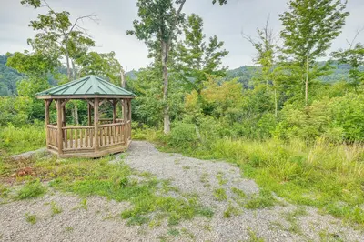 a wooden gazebo in the middle of a field at Chillicothe Cabin Near Hocking Hills State Park! in Chillicothe