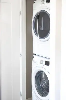 a washing machine and a dryer in a room at Luxury Downtown Townhome Private Garage Unit 16 in Cleveland
