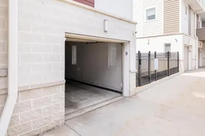 a garage with a door open in a building at Luxury Downtown Townhome Private Garage Unit 9 in Cleveland