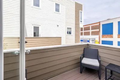 a balcony with a table and chairs on it at Luxury Downtown Townhome Private Garage Unit 9 in Cleveland