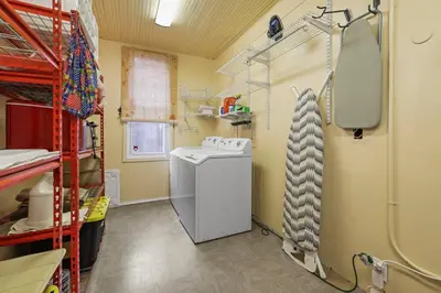 a laundry room with a washing machine in a room at Charming Victorian Home - 2 minutes to downtown in Lancaster
