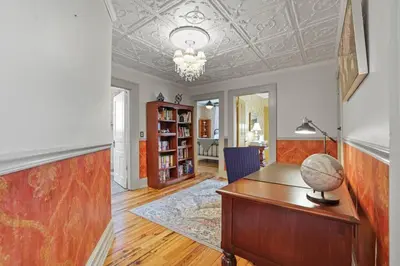 a home office with a desk and a lamp at Charming Victorian Home - 2 minutes to downtown in Lancaster