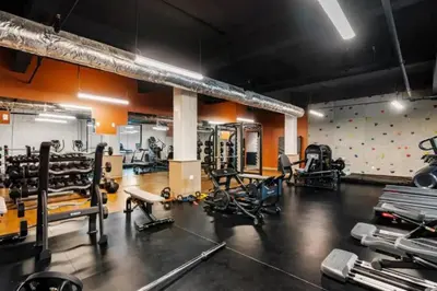 a gym with a lot of equipment in a room at Bengals Paycor Reds 6 min Walk Free Parking in Cincinnati