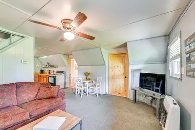 a living room with a couch and a table at 5 Mi to Cave Run Lake Wellington Cabin with Deck! in Wellington
