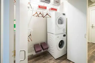 a laundry room with a washer and dryer at 2 Brand new apartments with city views in Cleveland