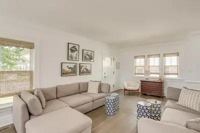 a living room with a couch and a table at Port Clinton Home with Lake View - Walk to Beach! in Port Clinton