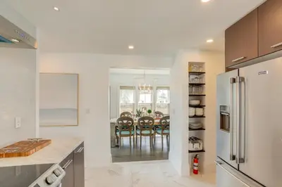 a kitchen with a table and a dining room at Port Clinton Home with Lake View - Walk to Beach! in Port Clinton