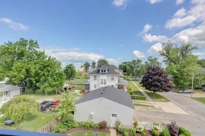 an aerial view of a white house on a street at Port Clinton Home with Lake View - Walk to Beach! in Port Clinton