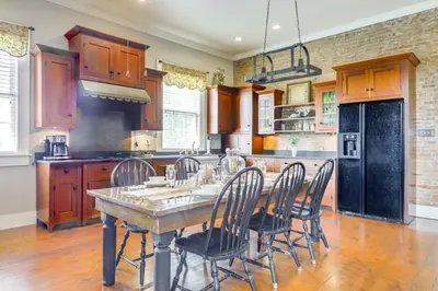 a large kitchen with a table and chairs at Vineyard Retreat at George Vest Historical Home in Verona