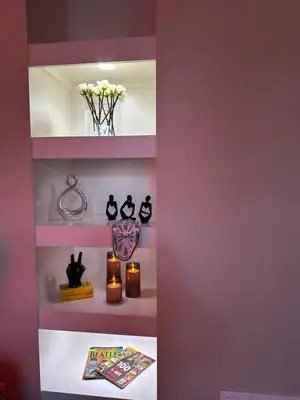 a room with purple shelves with candles and a book at Cozy King 2 bedroom at Easton near Airport in Columbus