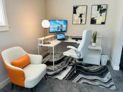 an office with a desk with a computer and a chair at Luxury Midterm Rental for Families, Medical and Corporate Professionals Cincy in Cincinnati