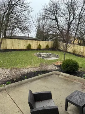 a backyard with a bench and a pond and a fence at Luxury Midterm Rental for Families, Medical and Corporate Professionals Cincy in Cincinnati