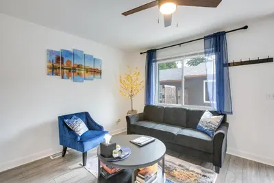 a living room with a couch and a table at Dayton Condo with Courtyard Less Than 3 to Downtown! in Dayton