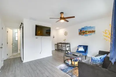 a living room with a couch and a ceiling fan at Dayton Condo with Courtyard Less Than 3 to Downtown! in Dayton