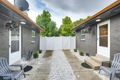 a patio with two chairs and a fence at Central Dayton Apt Less Than Half-Mi to UD! in Dayton