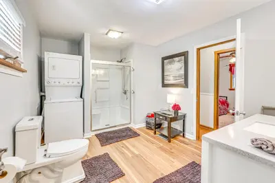 a bathroom with a toilet and a walk in shower at Spacious Ohio Family Home on 5-Acre Property! in New Philadelphia