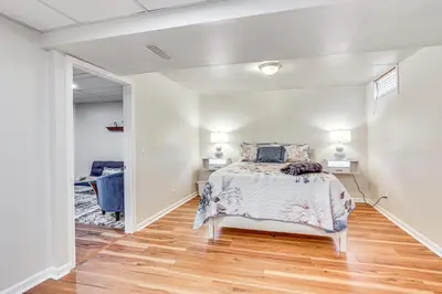 a bedroom with a bed and a hallway at Spacious Ohio Family Home on 5-Acre Property! in New Philadelphia