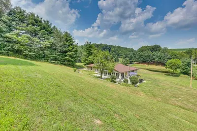 an overhead view of a house in a field at Spacious Ohio Family Home on 5-Acre Property! in New Philadelphia