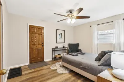 a bedroom with a bed and a ceiling fan at Comfort & Style - Mins to CLE Clinic - Family Friendly in South Euclid