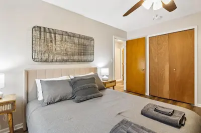 a bedroom with a bed and a ceiling fan at Comfort & Style - Mins to CLE Clinic - Family Friendly in South Euclid