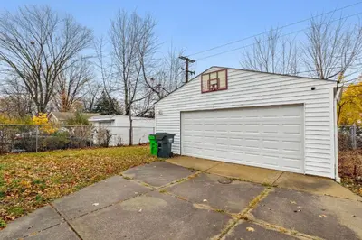 a white garage with a window on top of it at Comfort & Style - Mins to CLE Clinic - Family Friendly in South Euclid