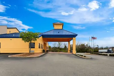 a building with a gazebo in a parking lot at Suburban Studios Mason Near Kings Island in Mason