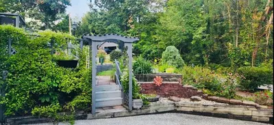 a garden with a gate and a stairway at Little Loch home in Burton