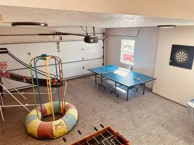 a play room with a table and a table at Little Loch home in Burton