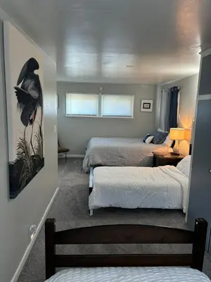 a bedroom with two beds and a room with two beds at Captains Cove in Port Clinton