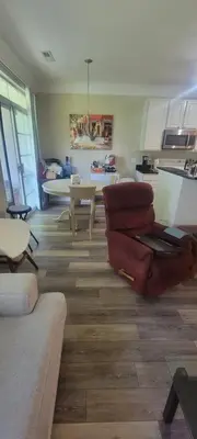 a living room with two couches and a dining room at Nice Condo on Nature Preserve in Dublin
