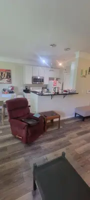 a living room with a couch and a table at Nice Condo on Nature Preserve in Dublin