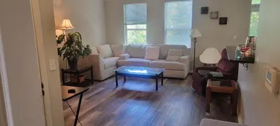 a living room with a couch and a table at Nice Condo on Nature Preserve in Dublin