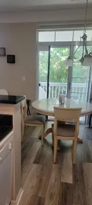 a kitchen and dining room with a table and chairs at Nice Condo on Nature Preserve in Dublin