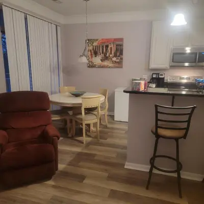 a kitchen and living room with a table and chairs at Nice Condo on Nature Preserve in Dublin
