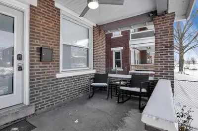 a patio with chairs and a table outside a building at The Columbus Adventure in Columbus