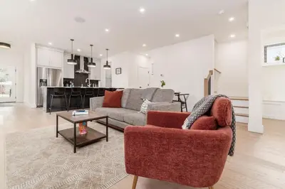 a living room with a couch and a table at Luxury Escape 4BR 3 bath Oasis in Historic Old Town in Columbus