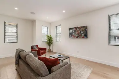 a living room with a couch and a chair at Luxury Escape 4BR 3 bath Oasis in Historic Old Town in Columbus