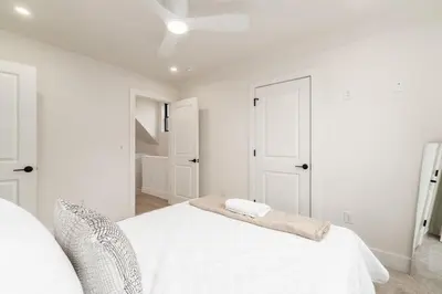 a white bedroom with a bed and a white ceiling at Luxury Escape 4BR 3 bath Oasis in Historic Old Town in Columbus