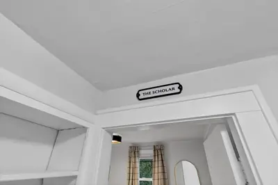 a sign on the ceiling of a room at The Ohio State of Mind 5BR 2BA in Columbus