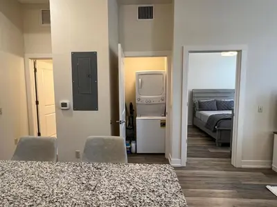 a bedroom with a bed and a tv and a bed at Strongback Suite 205 in Adrian